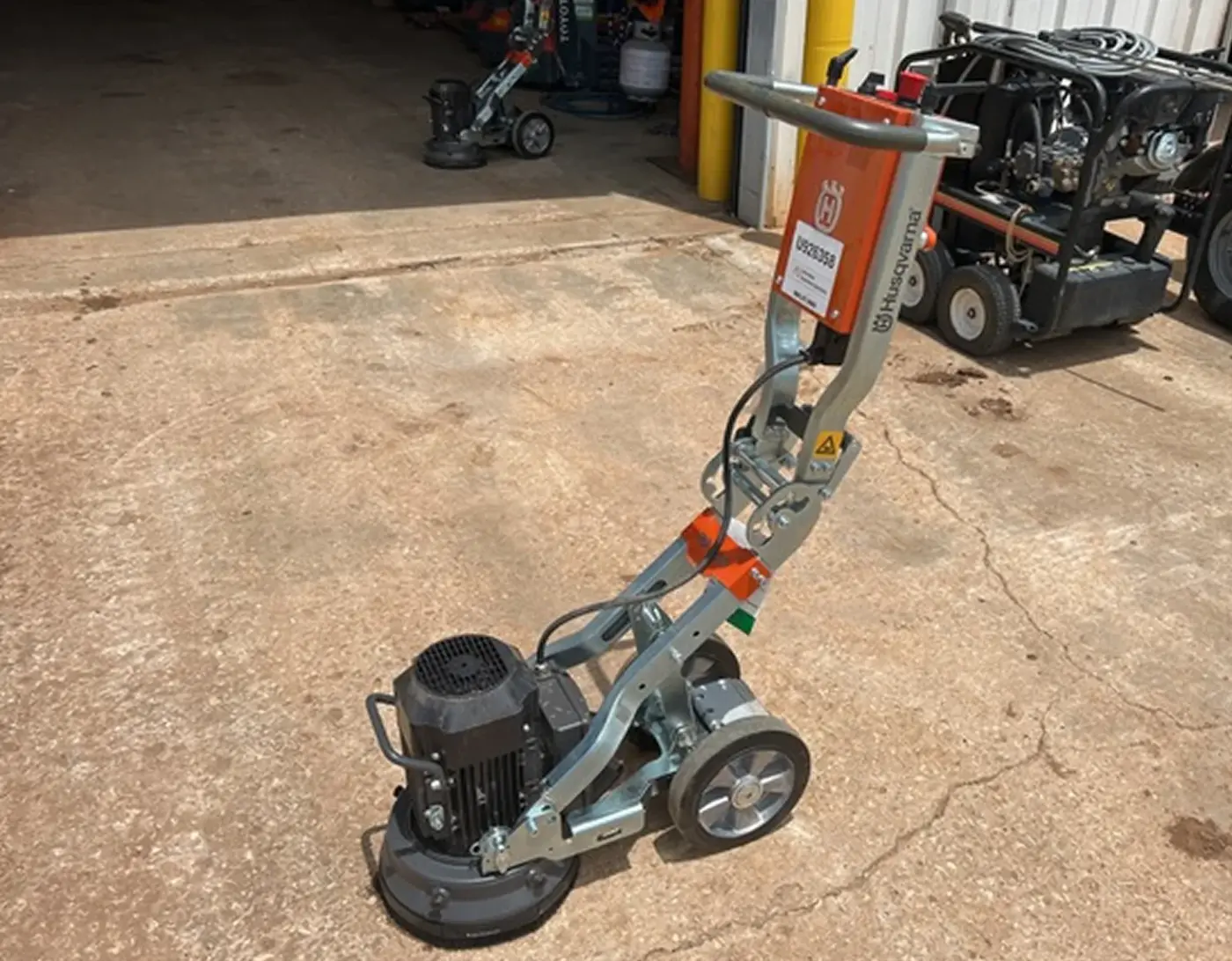 Concrete grinder and trowel machine on the apron of the Grafton Hire yard