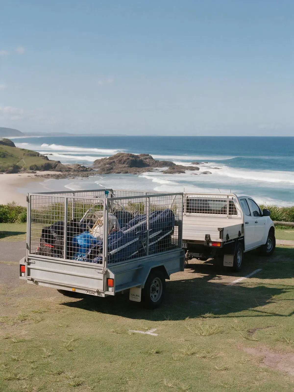 Illustration of a Grafton Hire ute and cage trailer loaded with marquee gear parked on the headland at Yamba