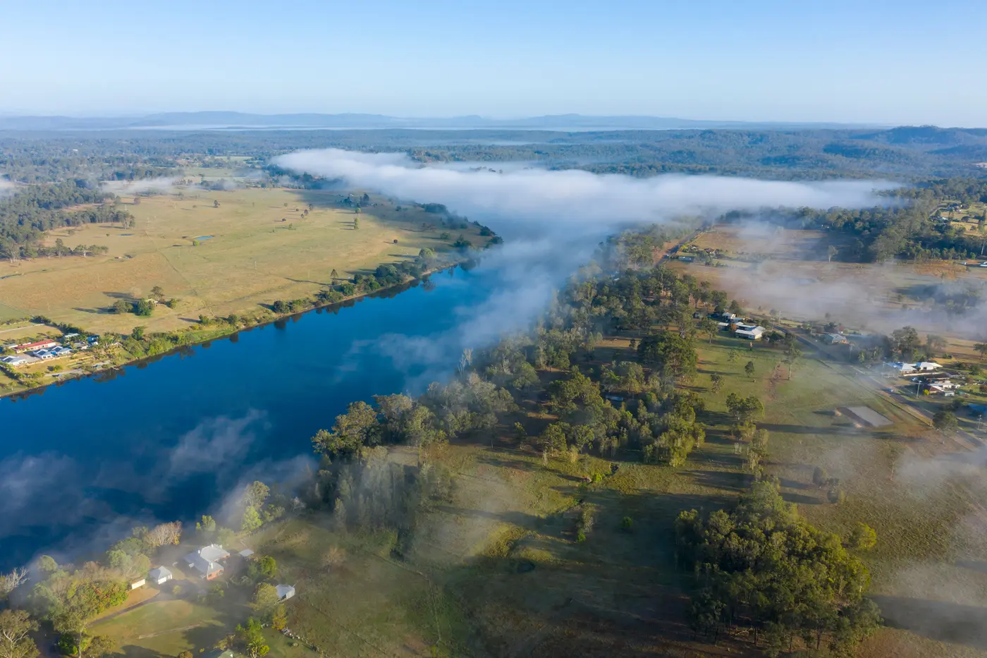 Aerial view of mist over a river and surrounding countryside near Grafton