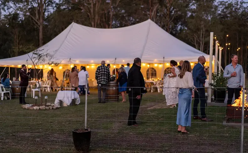 Marquee at dusk in a bush clearing