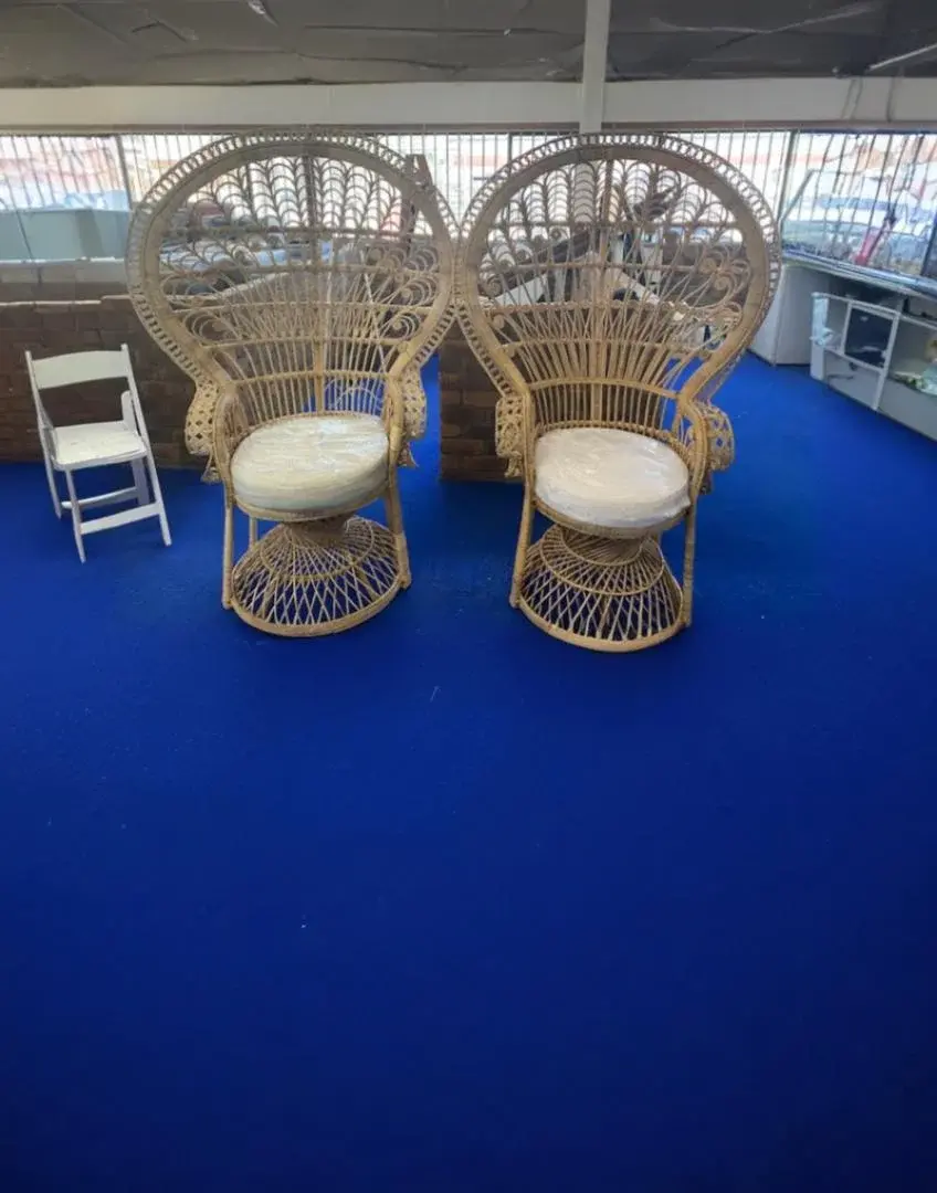 Peacock chairs and styled table settings in the Grafton Hire showroom