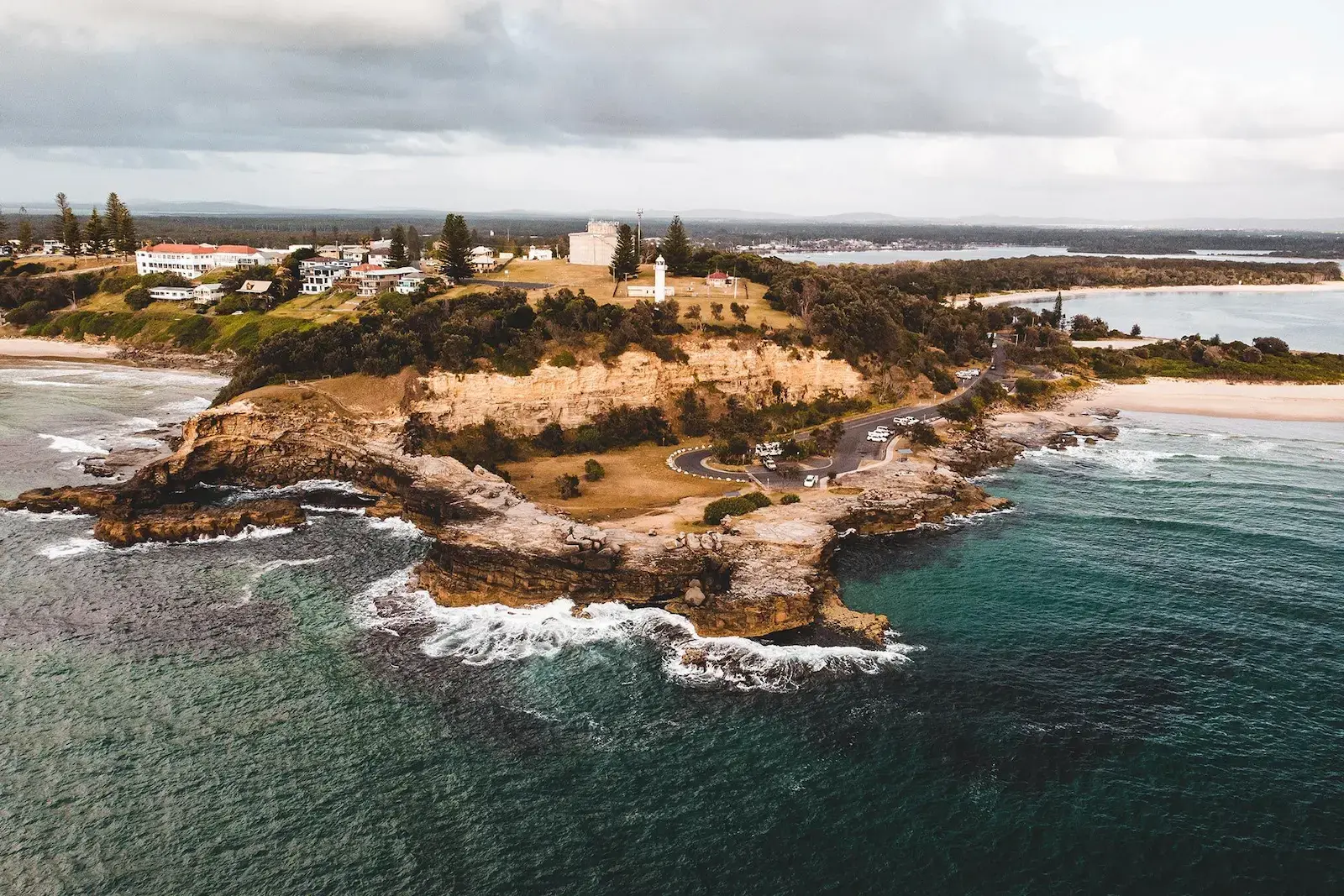 Aerial view of the Yamba headland, beach and breakwall at the mouth of the Clarence River